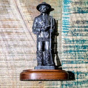 Vintage western frontiersman / trapper statue